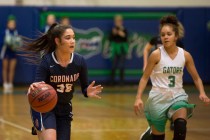 Coronado junior Haley Tyrell (35), left, takes the ball to the basket during a game at Green ...