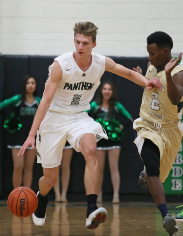 Palo Verde’s Grant Dressler, left, drives past Shadow Ridge’s Melvin Johnson on ...