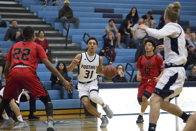 Foothill junior Marvin Coleman bring the ball up the court against Las Vegas at Foothill Hig ...