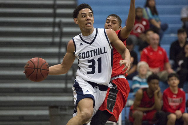 Foothill junior Marvin Coleman attempts to bring the ball to the basket at Foothill High Sch ...