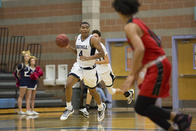 Foothill senior Mauricio Smith brings the ball up the court at Foothill High School on Tuesd ...