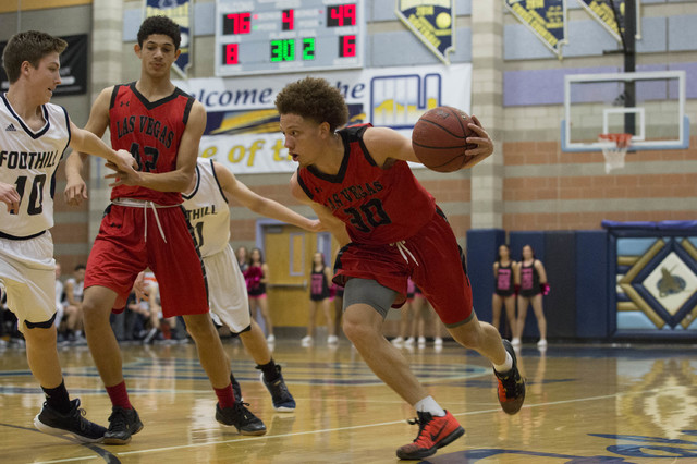 Las Vegas senior Jason Cullen attempts to drive the ball to the basket at Foothill High Scho ...