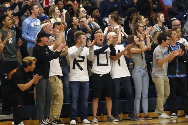Fans react during the first half of a semifinals Sunset Region high school basketball game o ...
