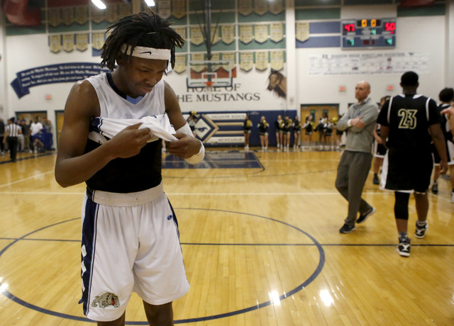 Centennial’s Isaiah Banks (10) reacts after his team loss to Clark during the semifina ...