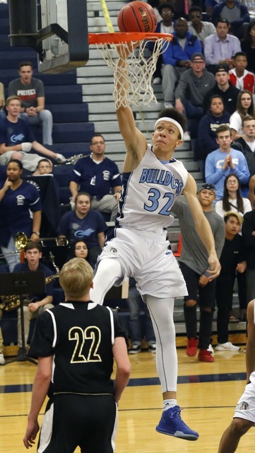 Centennial’s Darian Scott (32) dunks during the second half of a semifinals Sunset Reg ...