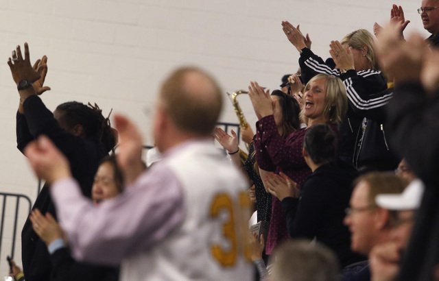 Fans react during the second half of a semifinals Sunset Region high school basketball game ...