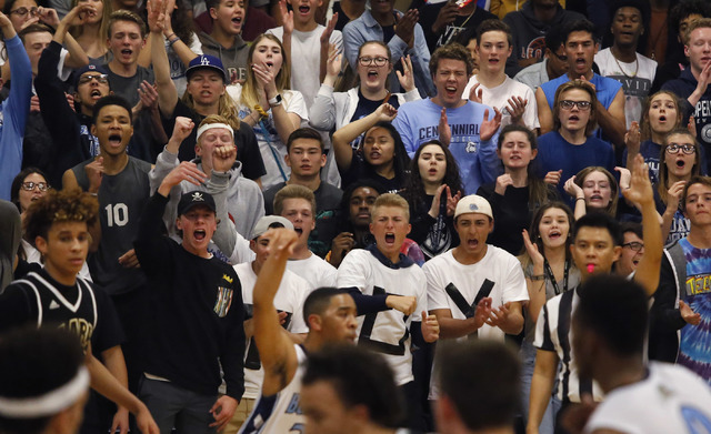 Fans react during the second half of a semifinals Sunset Region high school basketball game ...