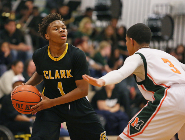 Clark’s Keyshaun Webb, left, is guarded by Mojave’s Daryl Adams during Monday’ ...
