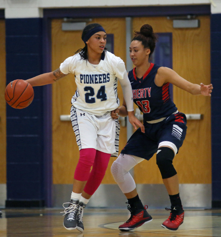 Canyon Springs’ Daijhan Cooks, left, is guarded by Liberty’s Aubre Fortner durin ...