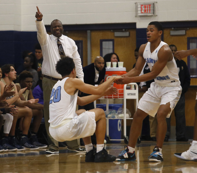Cheyenne head coach Teral Fair gestures to his players during a boys basketball game on Frid ...