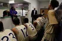 Cheyenne head coach Teral Fair speaks to his players at halftime during a boys basketball ga ...