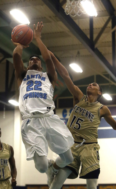 Canyon Spring’s Jovon Coleman (22) shoots over Cheyenne’s D’Andre Houston ...