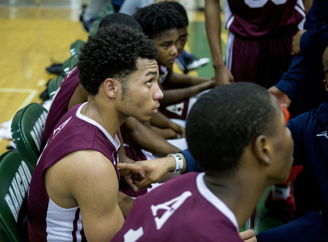 Agassi Prep Guard Allen Merritt, (5), center, sits during half time during a game against th ...