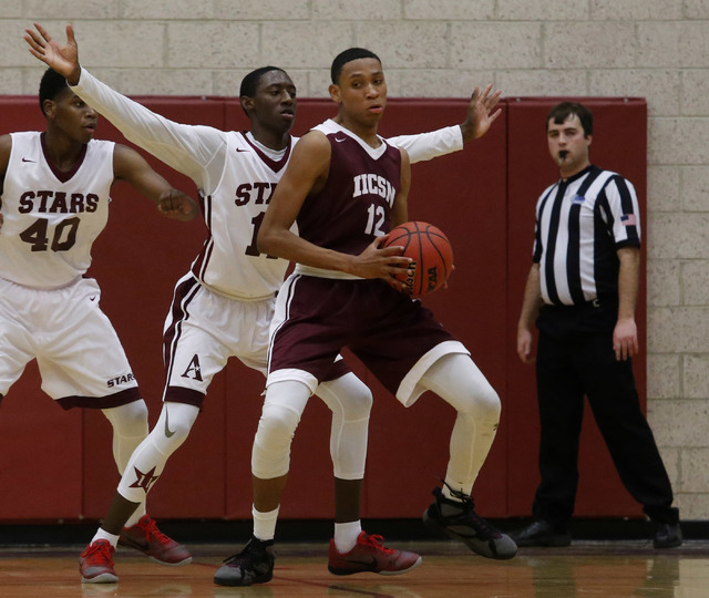 Innovations International’s Justin Evans (12) looks for a shot during a boys basketbal ...