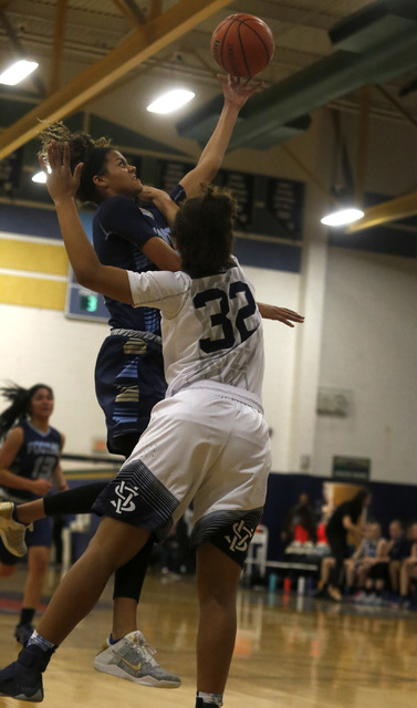 Foothill’s Rae Burrell (12) reaches for a rebound during a basketball game at Spring V ...