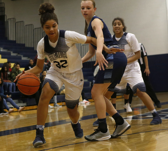 Spring Valley’s Lynnae Wilds (32) drives towards the hoop during a basketball game at ...