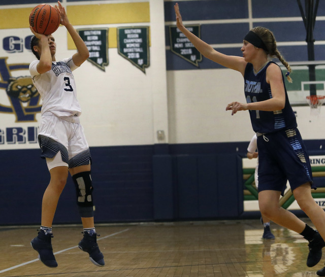 Spring Valley’s Essence Booker (3) shoots during a basketball game at Spring Valley Hi ...