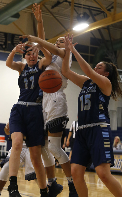 Foothill’s Kylie Vint (11), from left, Spring Valley’s Alyssa Scott (23) and Foo ...