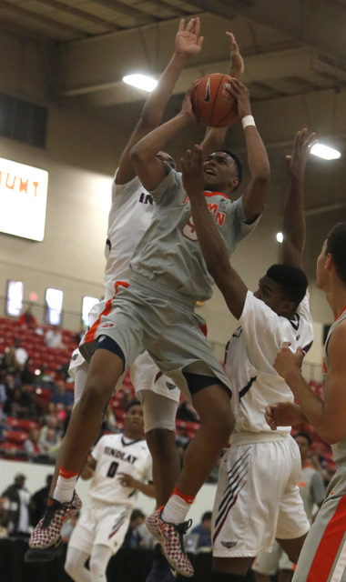 Bishop Gorman’s Chuck O’Bannon (5) shoots during a high school basketball game a ...