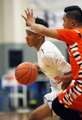 Desert Pines’ Capri Uzan, left, is guarded by Chaparral’s Robin Rosales during a gam ...