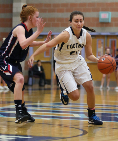 Foothill’s Taylor Turney, right, drives the ball past Coronado’s Karlie Thorn du ...