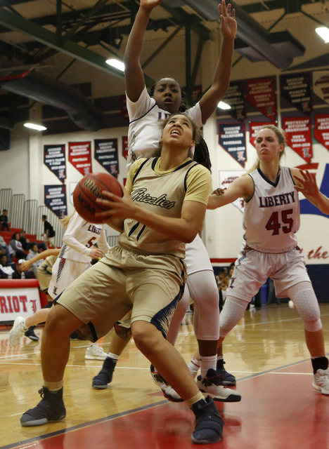 Spring Valley’s Kayla Harris (11) looks for a shot during a girls basketball game on F ...