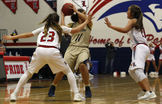 Spring Valley’s Kayla Harris (11) is double teamed by Liberty’s Alexis Tomassi ( ...