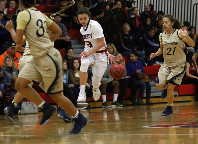 Liberty’s Celine Quintino (3) drives down the court during a girls basketball game on ...