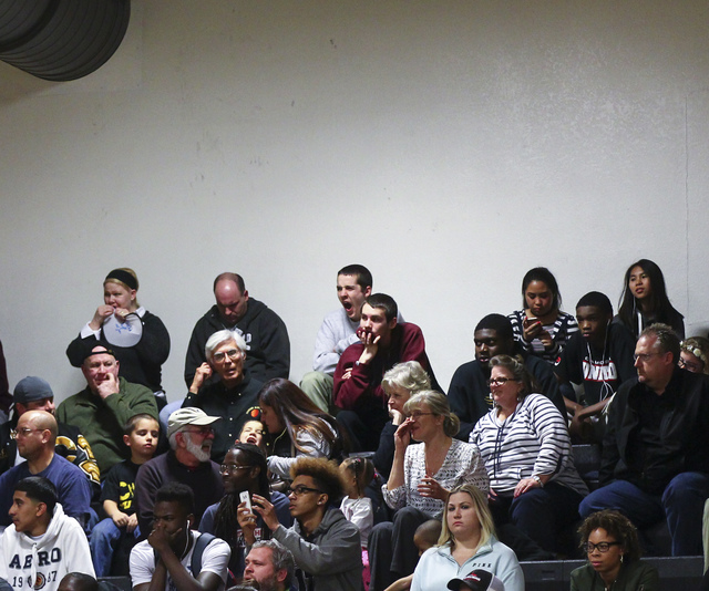 Clark fans look on as their team trails Bishop Gorman near the end of a basketball game at C ...