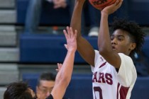 Agassi Prep’s Akeemis Williams (0) takes a shot against Mountain View in the boy&#8217 ...