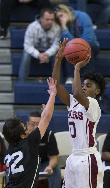 Agassi Prep’s Akeemis Williams (0) takes a shot against Mountain View in the boy&#8217 ...