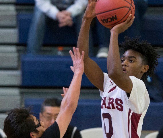 Agassi Prep’s Akeemis Williams (0) takes a shot against Mountain View in the boy&#8217 ...