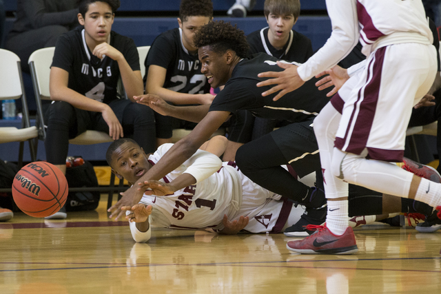 Agassi Prep’s Najeeb Muhammad (1) makes a pass from the floor against Mountain View in ...
