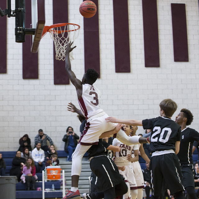 Agassi Prep’s Caleb Ormond (3) goes up for a layup against Mountain View in the boy&#8 ...