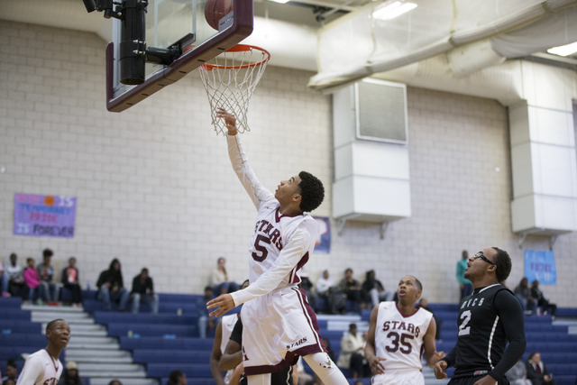 Agassi Prep’s Allen Merritt (5) goes up for a layup against Mountain View in the boy&# ...
