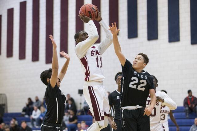 Agassi Prep’s Jared Holmes (11) goes up for a shot against Mountain View in the boy&#8 ...
