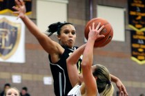 Clark’s Bobbi Floyd lines up to block a shot by Faith Lutheran’s Dani Tharaldson ...