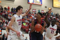 Findlay Prep’s Justin Jackson (15) looks to pass as Bishop Gorman’s Stephen Zimm ...