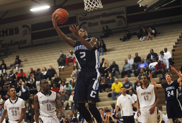 Centennial’s Troy Brown (2) drives to the hoop uncontested on Friday night. Brown had ...