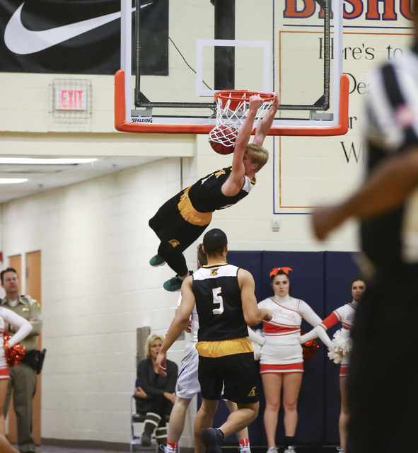 Clark guard Trey Woodbury (22) dunks during a basketball game at Bishop Gorman High School i ...