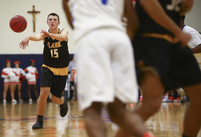 Clark guard James Bridges (15) makes a pass during a basketball game at Bishop Gorman High S ...