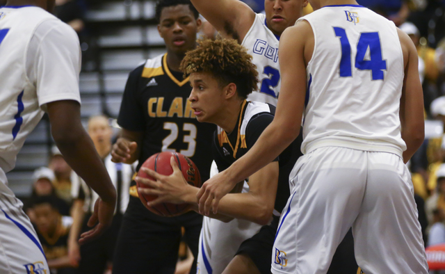 Clark forward Jalen Hill (20) looks for an open pass during a basketball game at Bishop Gorm ...