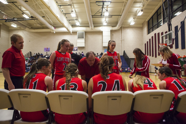 The Lincoln County girls basketball gather during a timeout at Andre Agassi College Preparat ...
