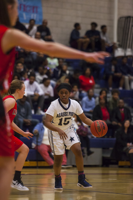Agassi Prep guard Denise Parker (15) drives the ball during a game against Lincoln County at ...