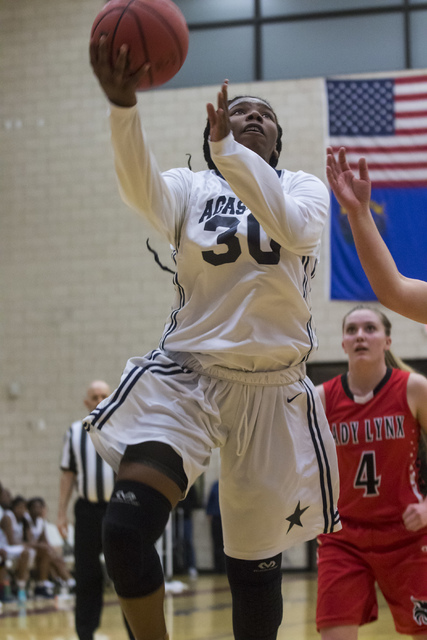 Agassi Prep guard Sharmayne Finley (30) shoots the ball during a game against Lincoln County ...