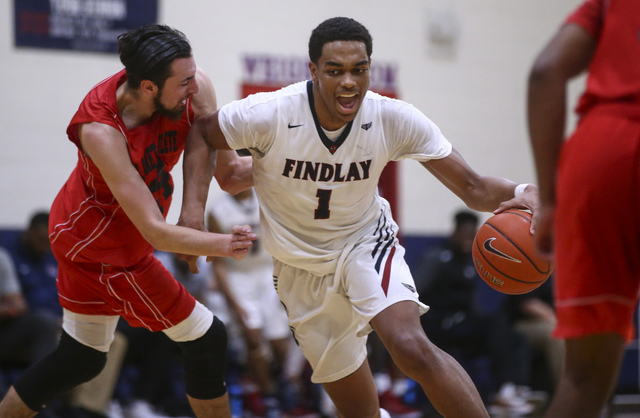 Findlay Prep forward P.J. Washington (1) drives against Planet Athlete’s Yanis Takerbo ...