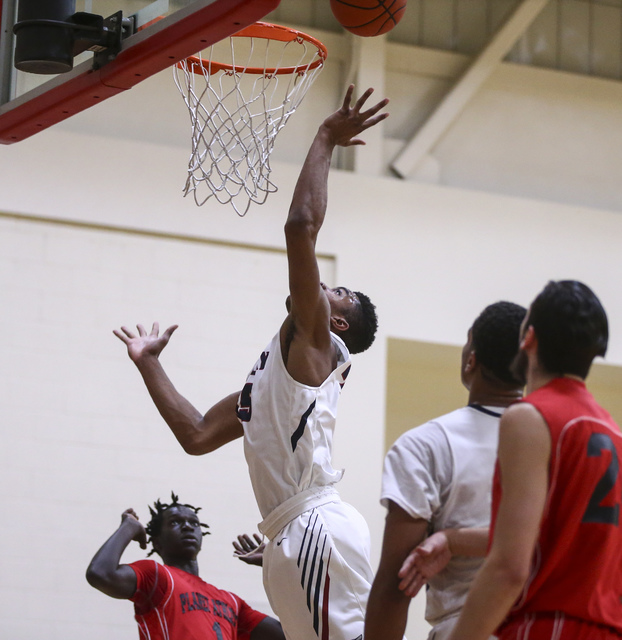 Findlay Prep forward Reggie Chaney (35) sends in a shot to score against Planet Athlete duri ...