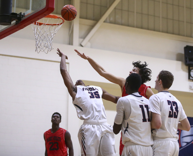Findlay Prep forward Reggie Chaney (35) attempts a shot against Planet Athlete during a bask ...