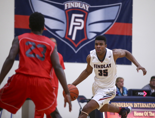 Findlay Prep forward Reggie Chaney (35) drives against Planet Athlete during a basketball ga ...