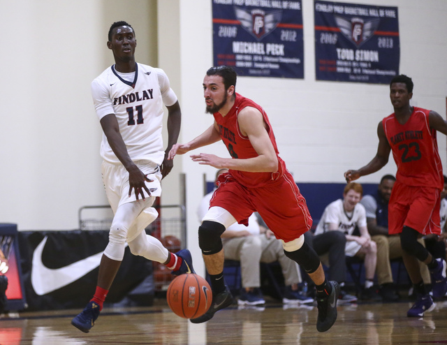 Findlay Prep forward Lamine Diane (11) drives against Planet Athlete’s Yanis Takerbous ...